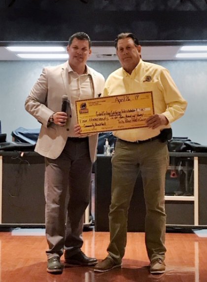 Tachi General Manager Michael Olujic presents a check from the Community Breakfast to CIF Executive Director Jeff Cardoza.